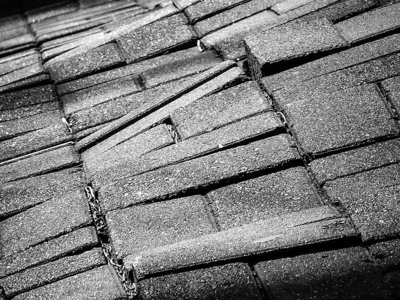 Asphalt shingles broken down at the eave of a roof, letting water past the covering